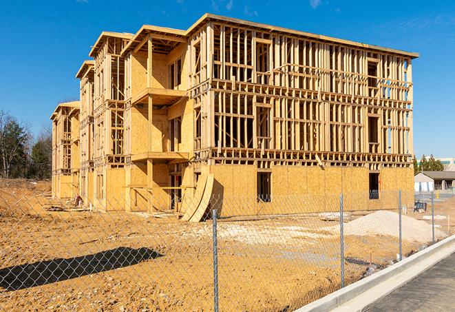 construction zone secured with a temporary fence, marked with warning signs in Dillsburg, PA